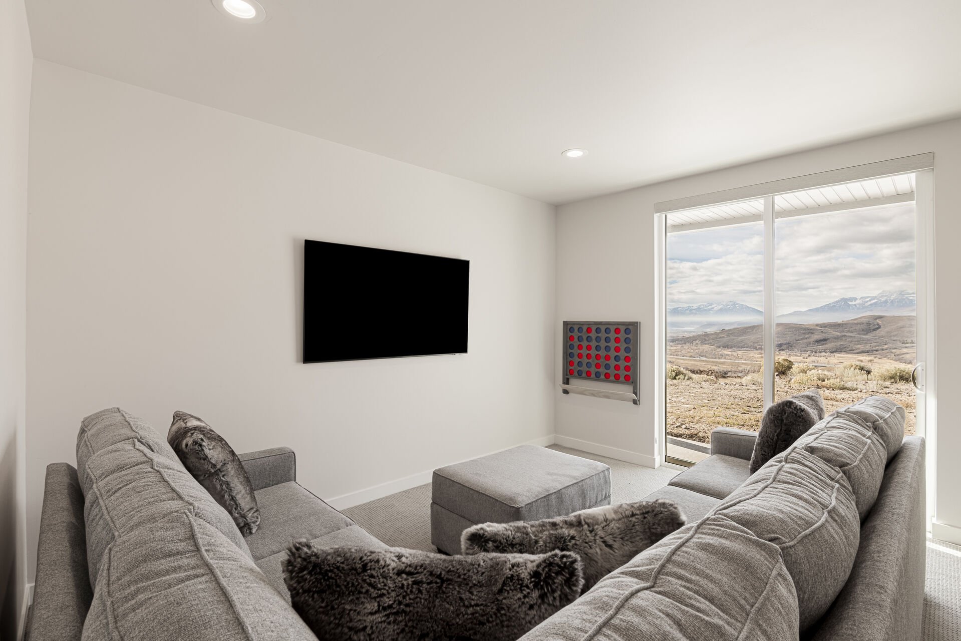 Lower level family room with a Smart TV and Connect 4 game