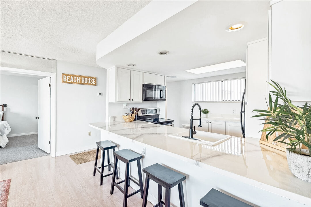 Modern and stylish kitchen with bar seating and plenty of natural light