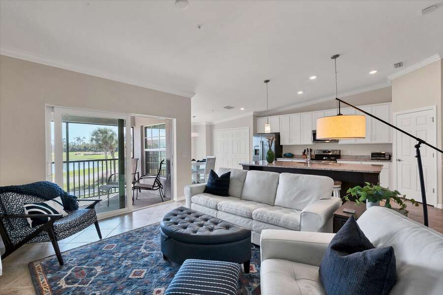Open living space with ample, comfy seating and great view of golf course