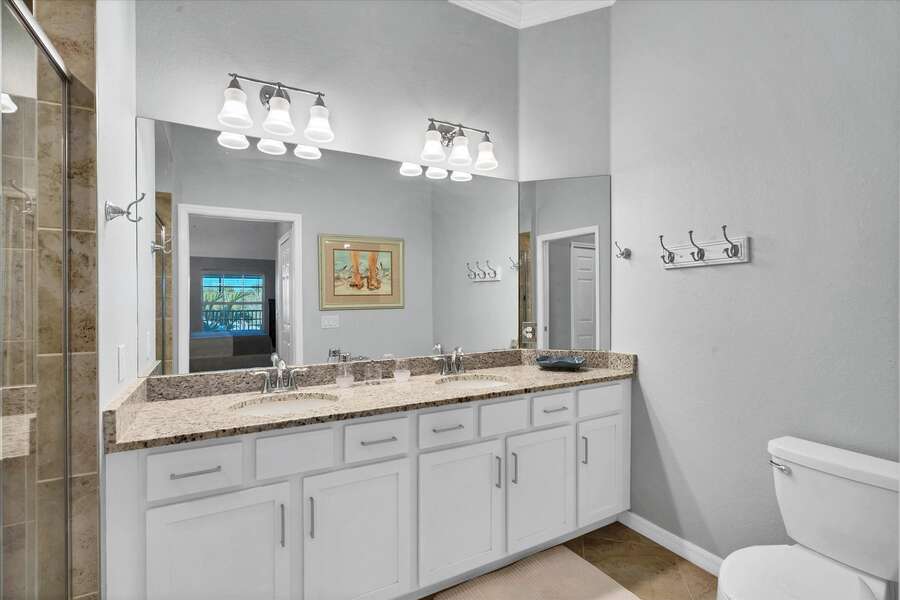Primary bathroom with double vanity and walk-in shower