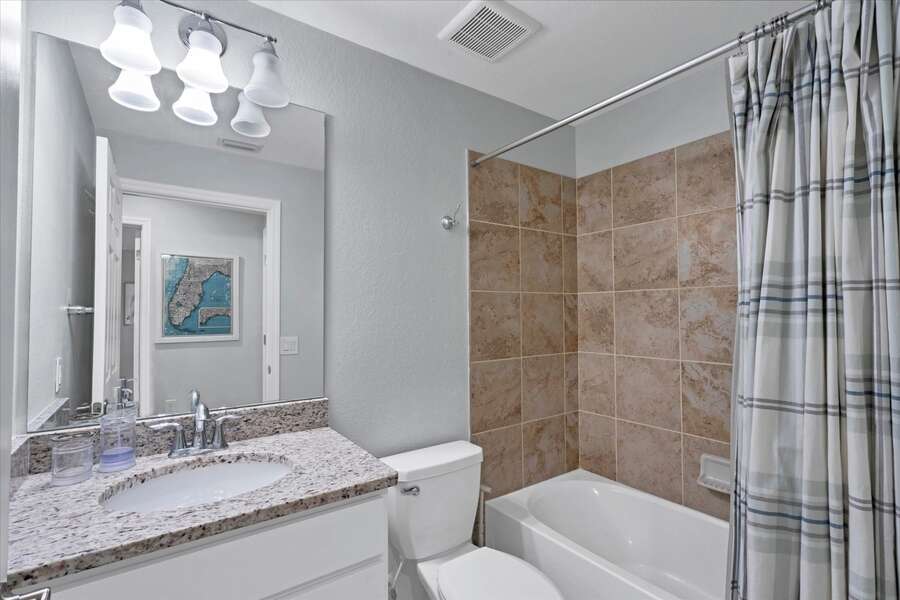 Guest bathroom features shower/tub combo
