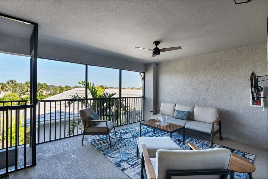 Screened-in balcony is perfect for relaxing or entertaining