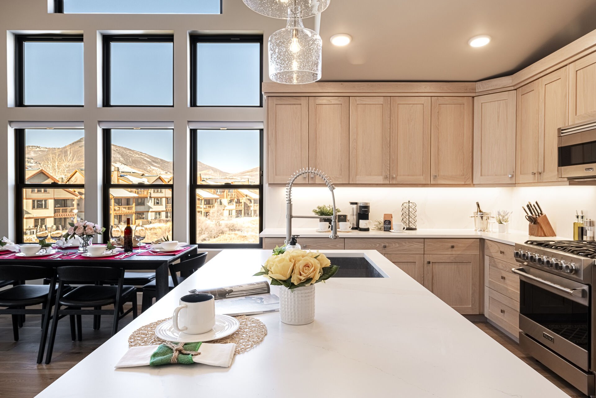 Chef's kitchen with a ski resort mountain backdrop