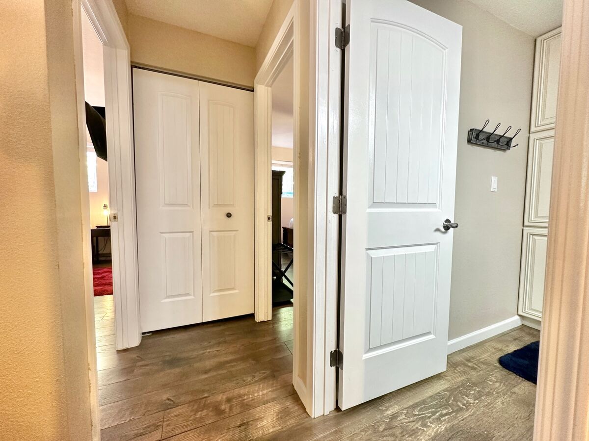 Step down the hall to the 2 of the 3 bedrooms