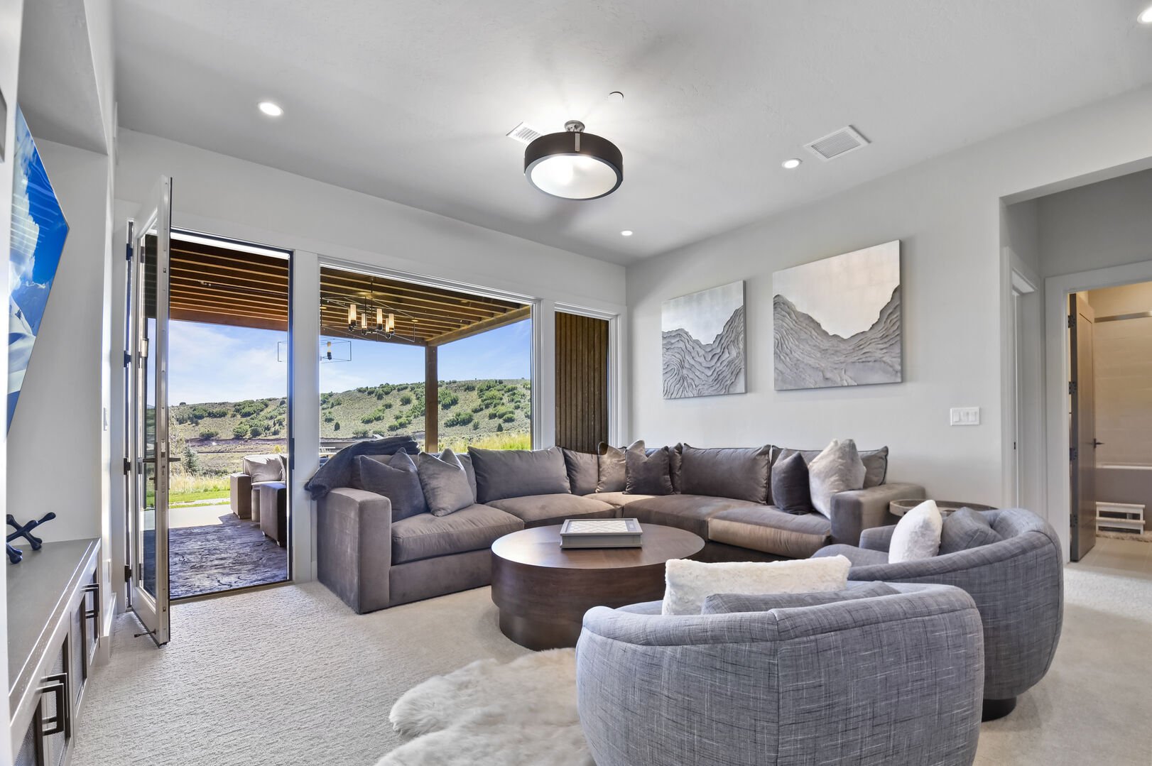 Second living room with spacious sectional.