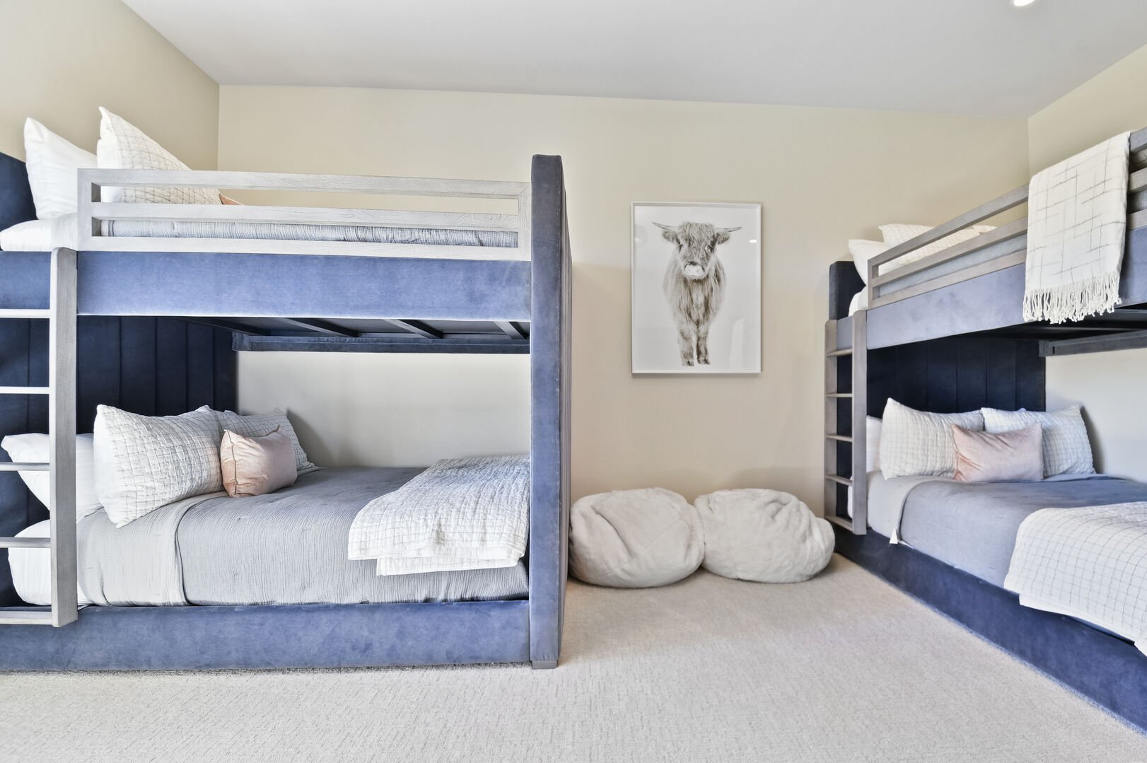 Bunk bedroom with two queen-over-queen bunks.