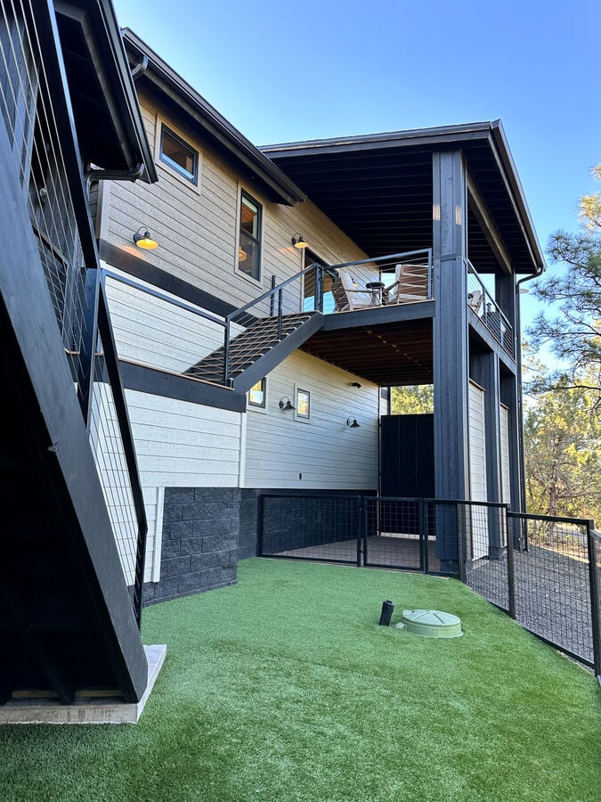 Dog yard is also a shared space with homeowners when they are using the main house.