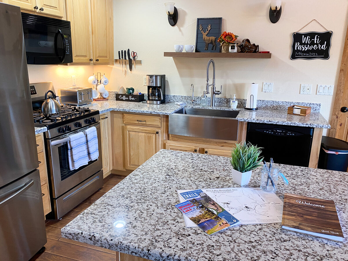 Modern kitchen appliances and granite counters perfect for making meals at home