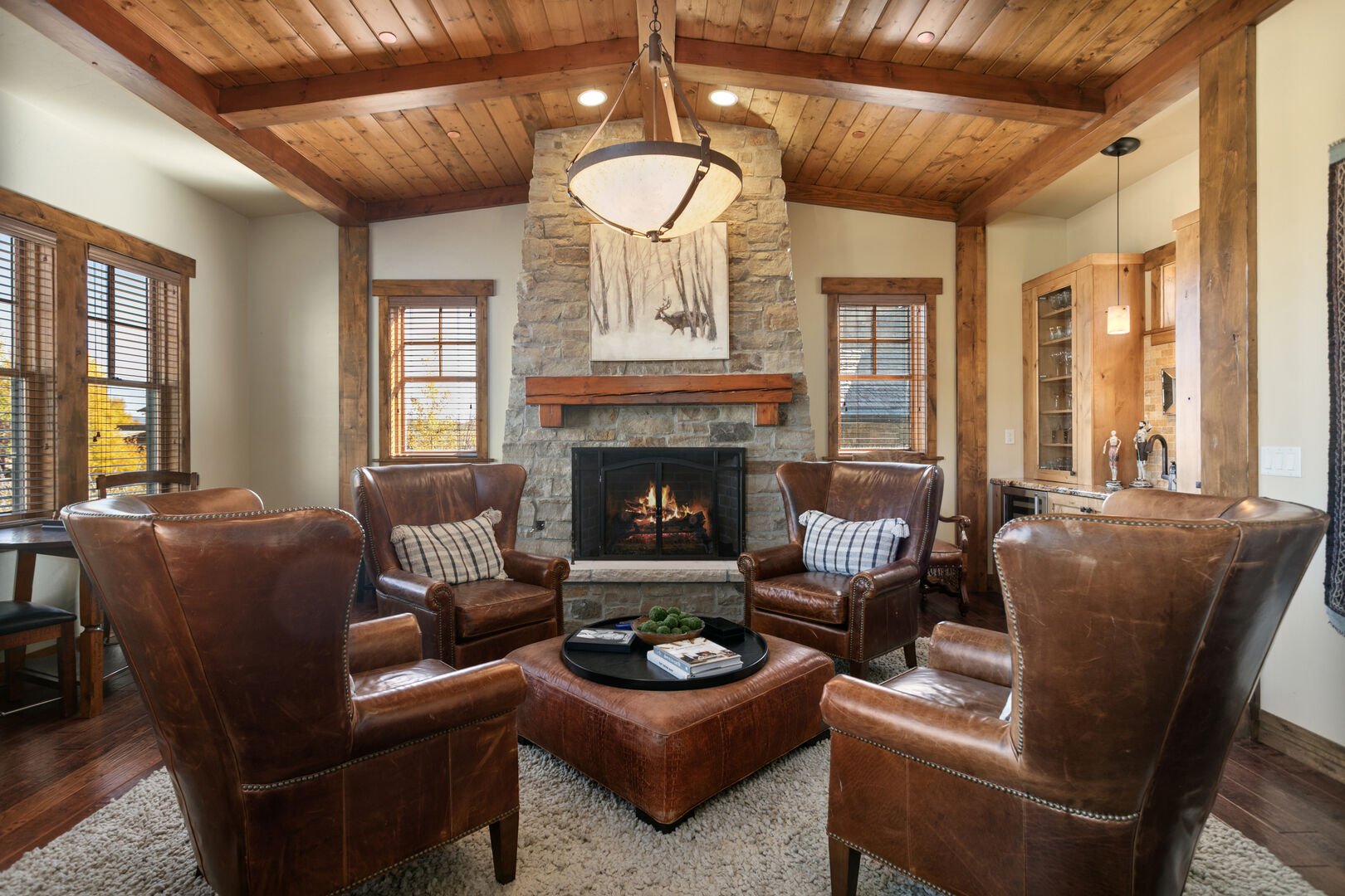Comfortable chairs surrounding the cozy fireplace.