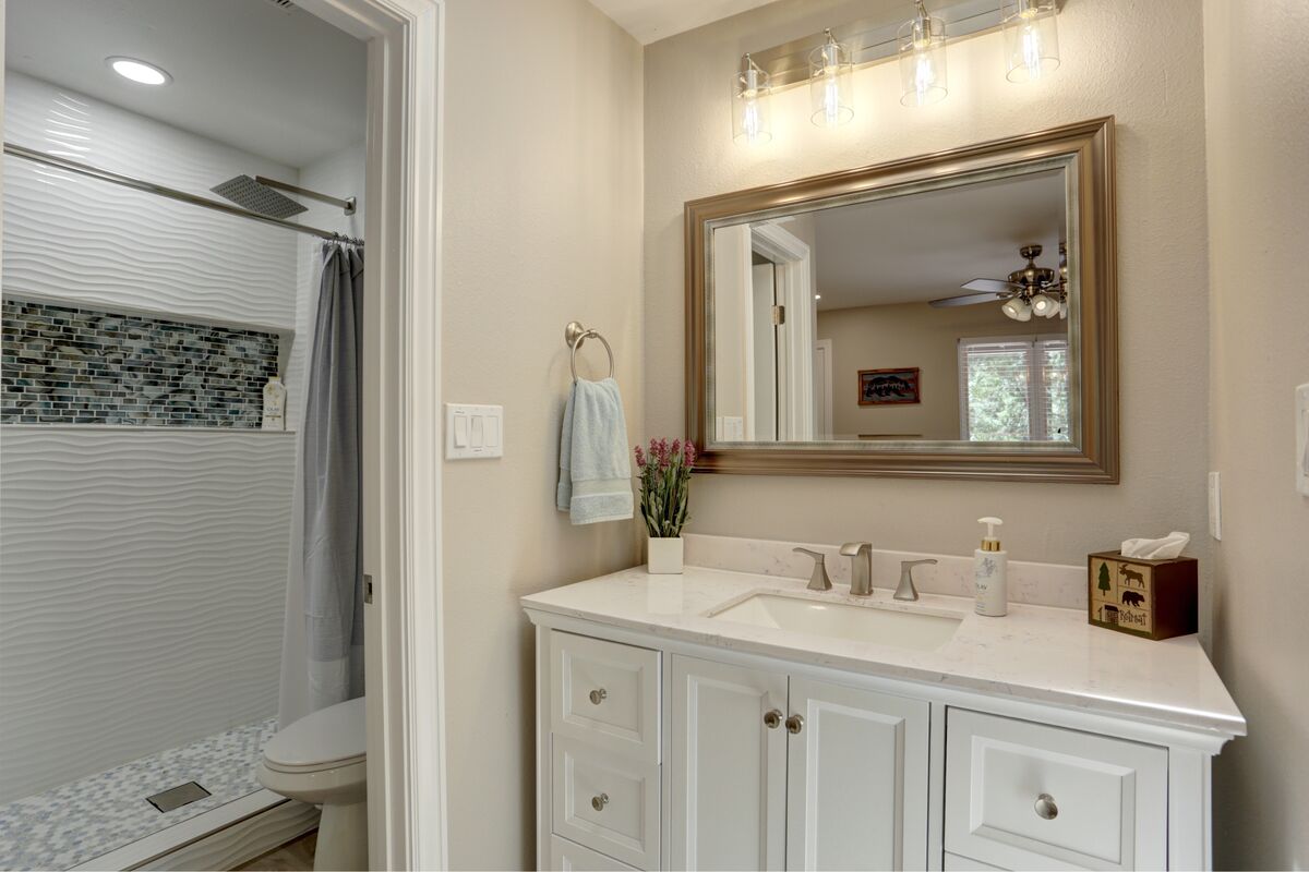 Main ensuite bathroom has a walk-in shower, plenty of lighting and toiletries provided.