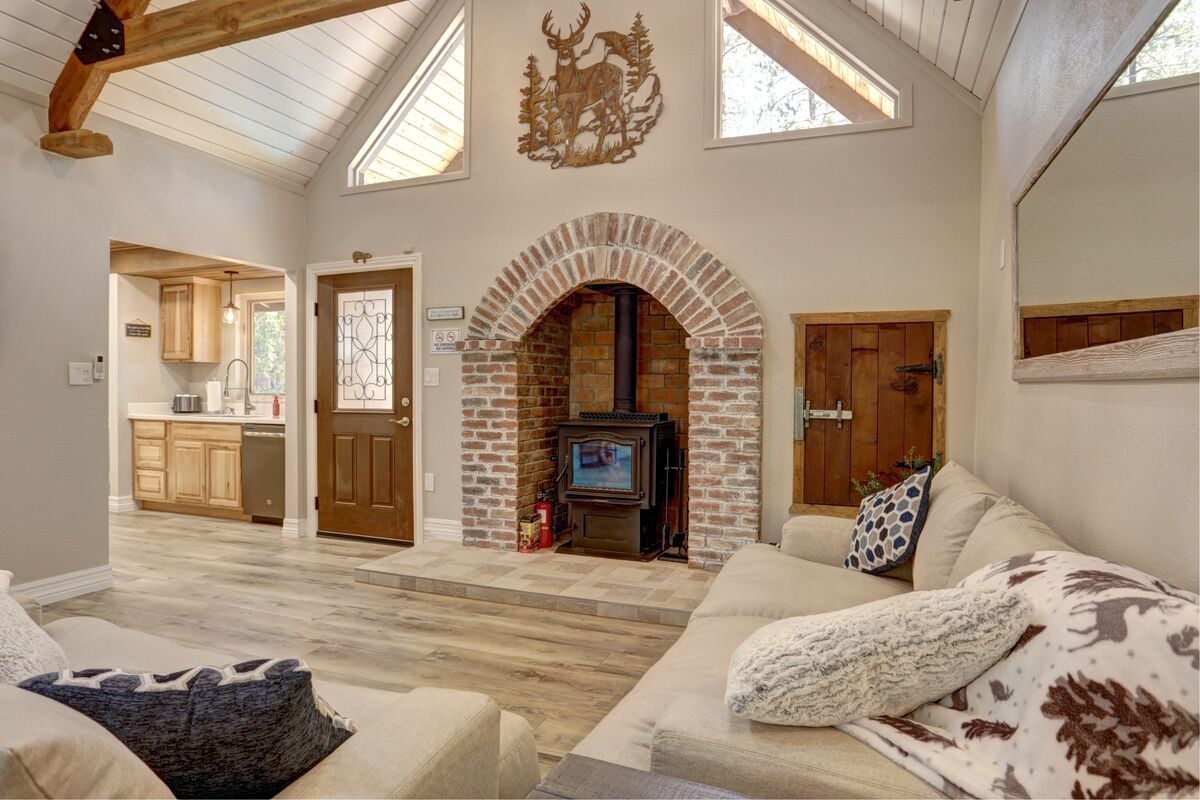 Step right in to the huge vaulted ceilings, natural light and a cozy wood-burning stove to keep you warm all winter long!