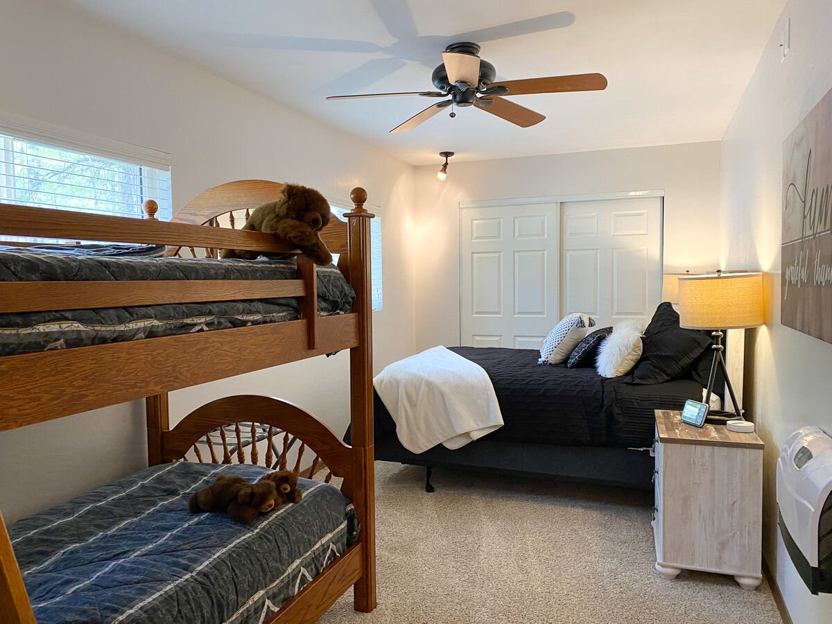Family bedroom includes twin bunks and queen bed!