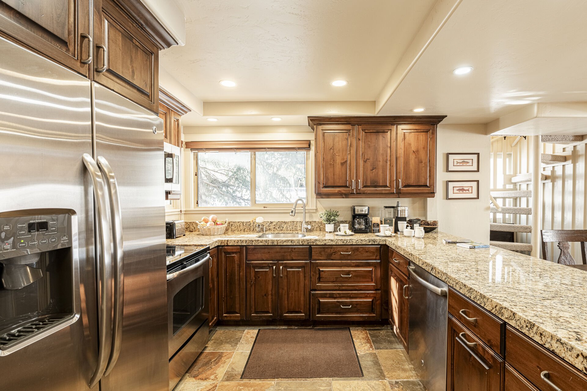 Kitchen with Stainless Steel Appliances, Granite Counters, and Electric Range
