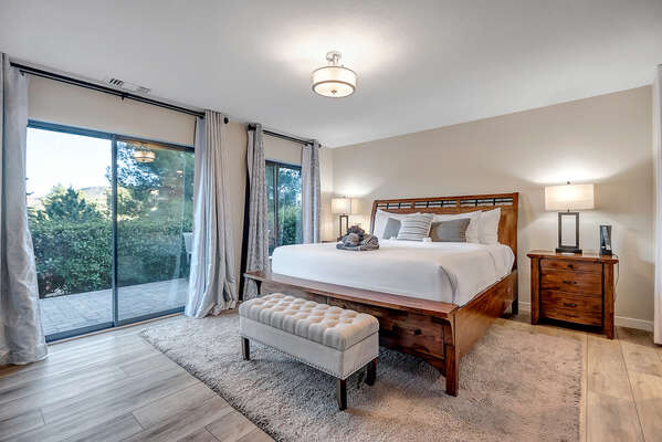 Master Bedroom with California King Bed, Patio Access and En Suite Bathroom