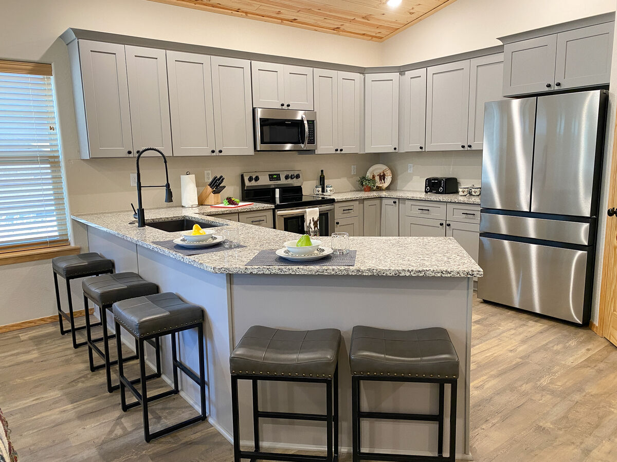 Enjoy meals in the fully stocked kitchen with plenty of space to entertain