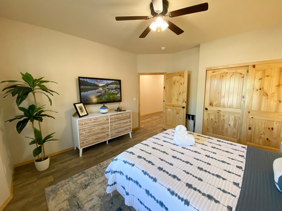 Guest bedroom includes private smart TV