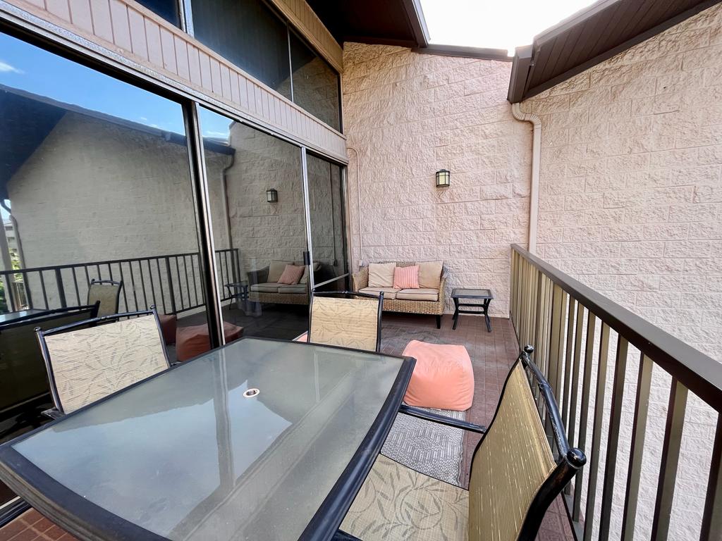Your spacious balcony with table and chairs!