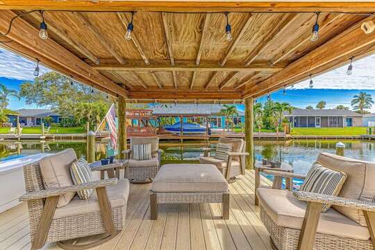 Enjoy evening cocktails or morning coffee at over the water in the covered boat dock!