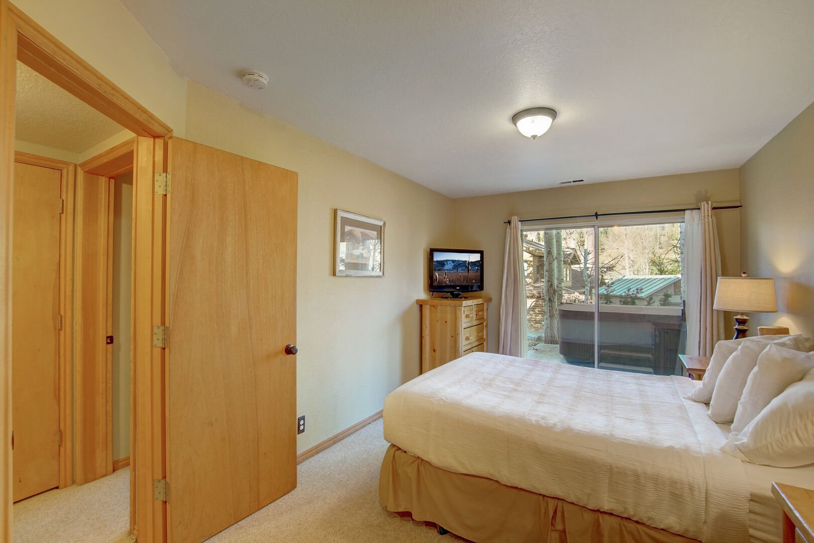 Primary Bedroom with 1 Queen Bed / Doors to Private Hot Tub