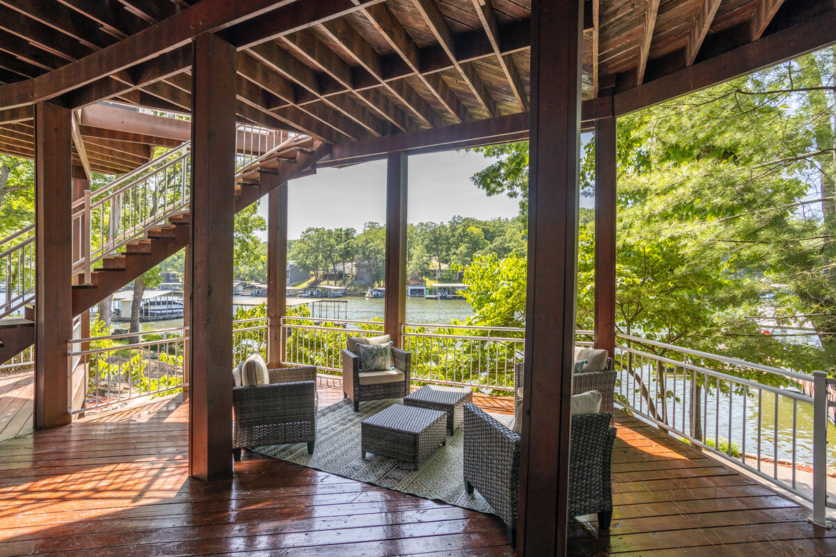 The main level balcony offers a scenic view of the lake, and is also perfect for outdoor dining or gathering.