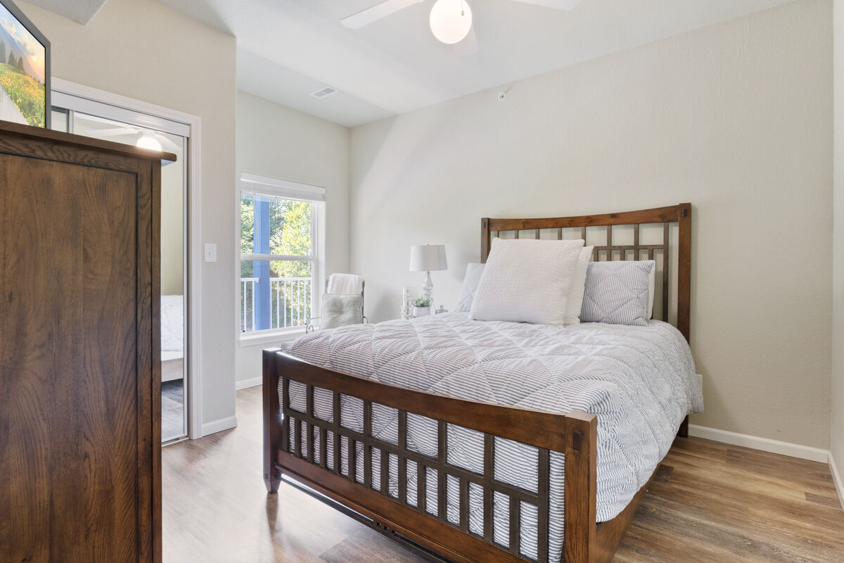 Retreat to your queen bedroom with ample space.