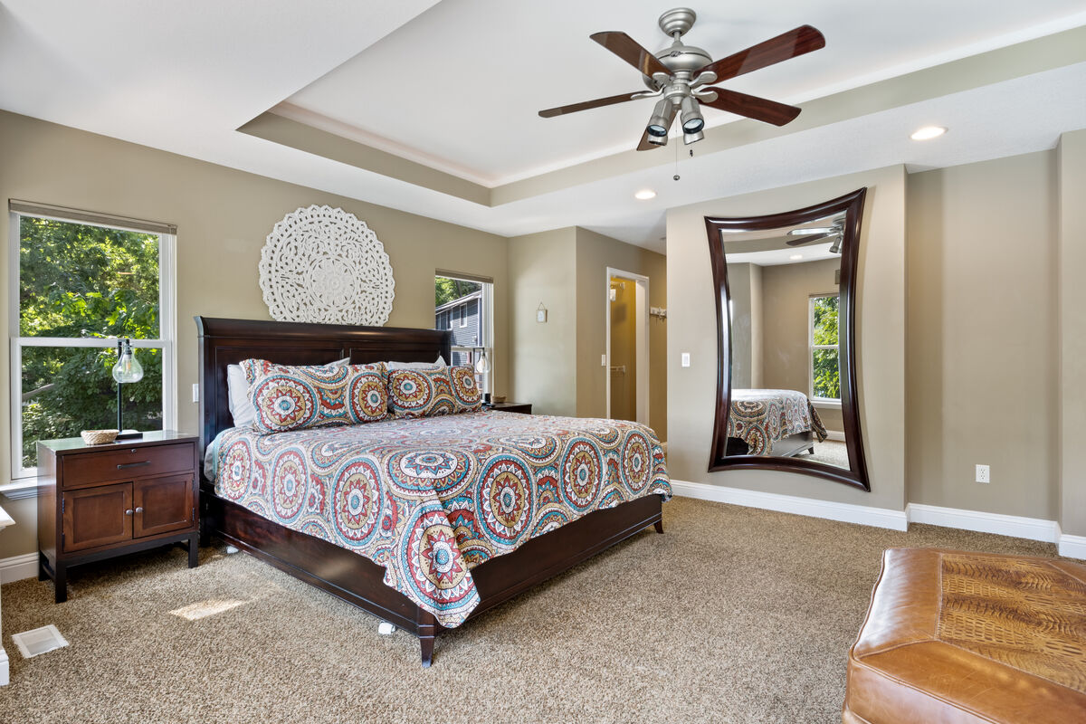 Unwind and enjoy a peaceful night's sleep in the large and cozy master bedroom.