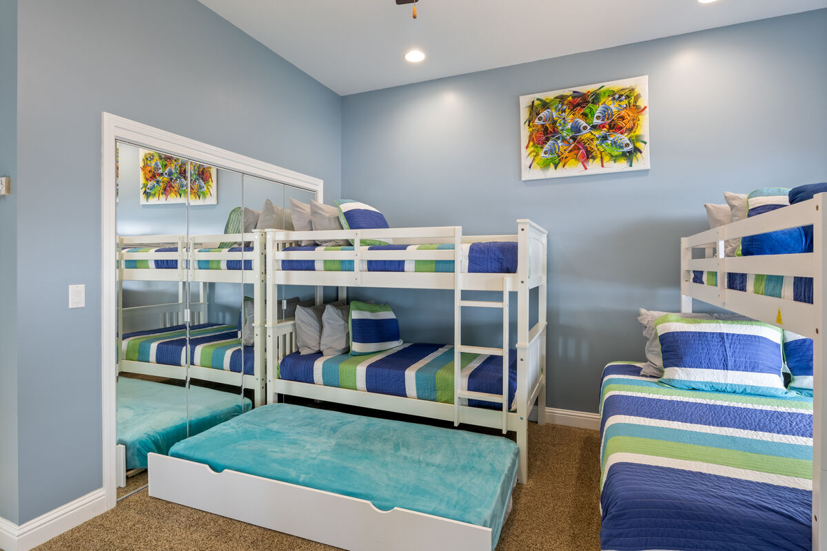 Bunk beds in one room plus a mattress to accommodate extra sleeps.