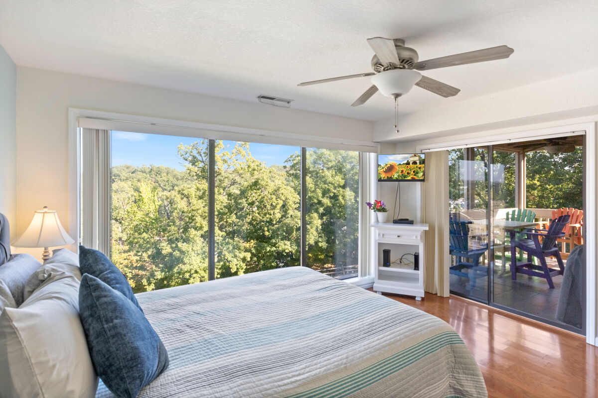 Natural Setting surrounded by trees on the land side of the master suite and the balcony.