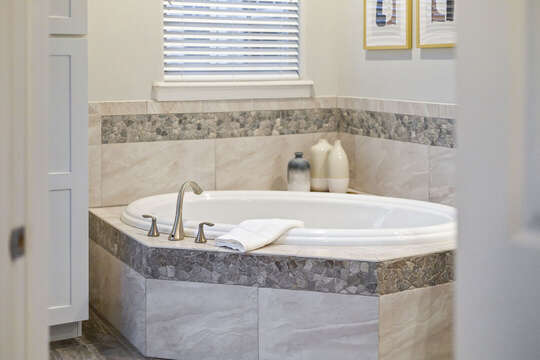 Jetted tub in master bathroom.