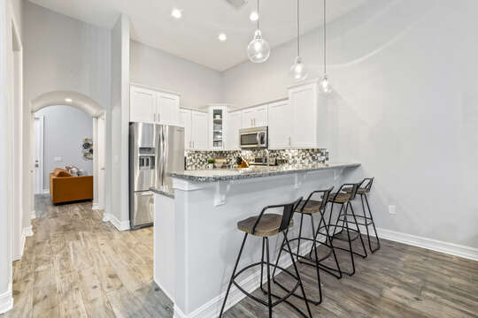 Open kitchen with barstools.