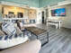 Living, dining and kitchen area open to natural light