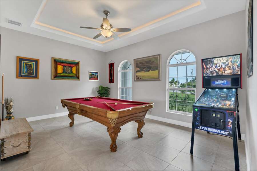 Game room featuring pool table & Star Wars pinball game