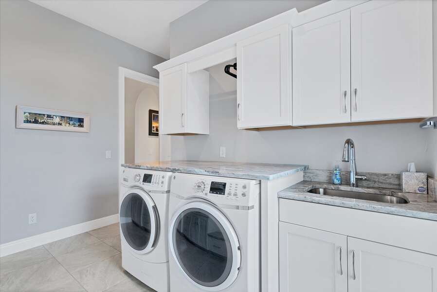 Spacious laundry room with full-size washer & dryer