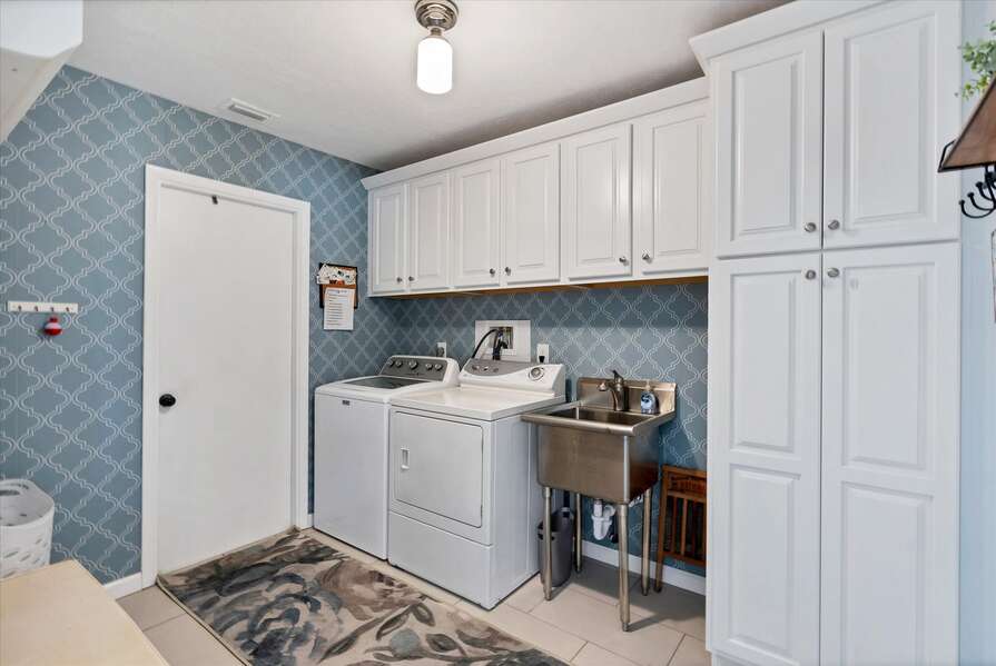 Laundry room features full-size washer & dryer and garage access