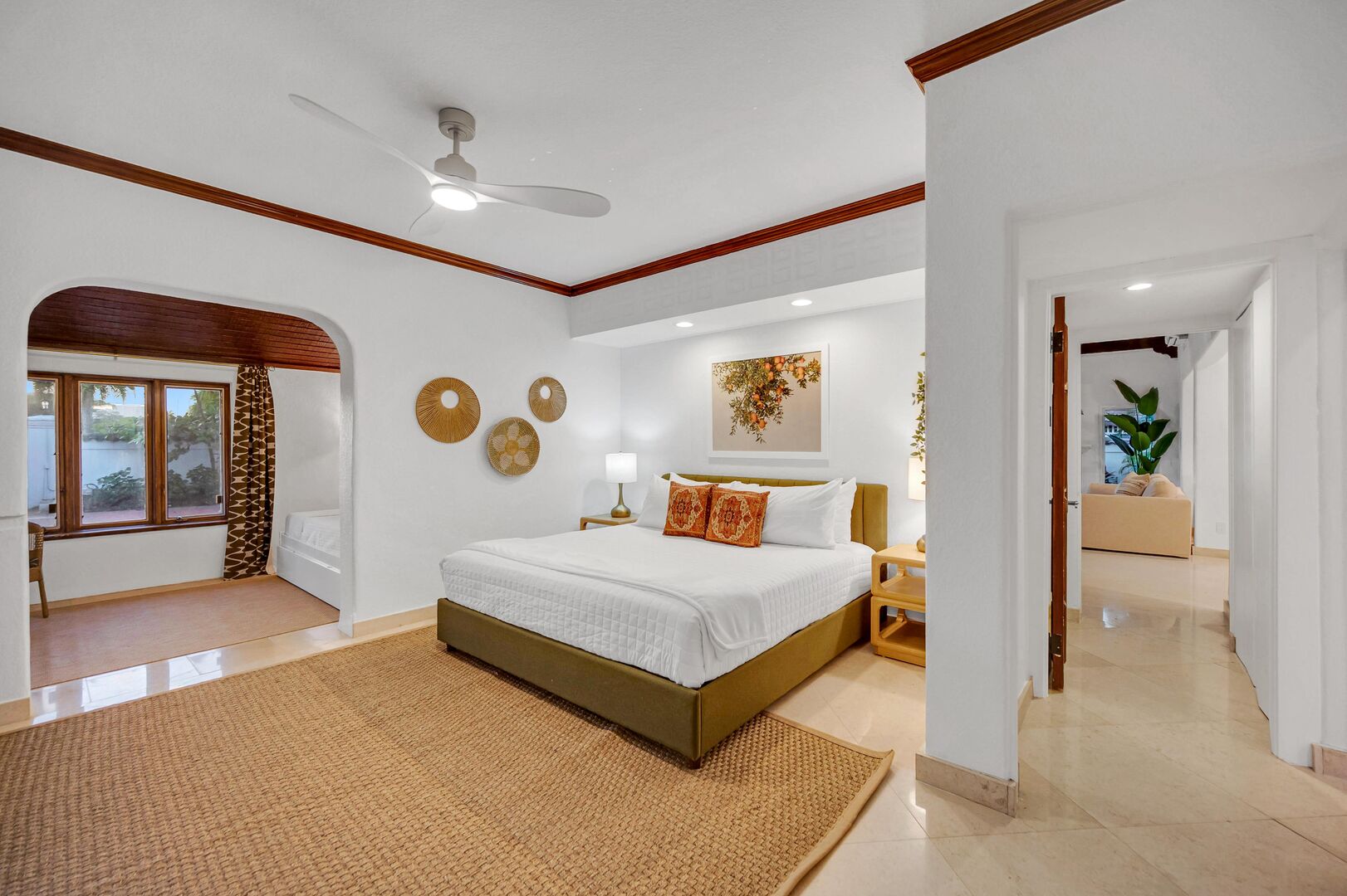 The primary bedroom is located on the ground floor and features one king size and two twin beds.
