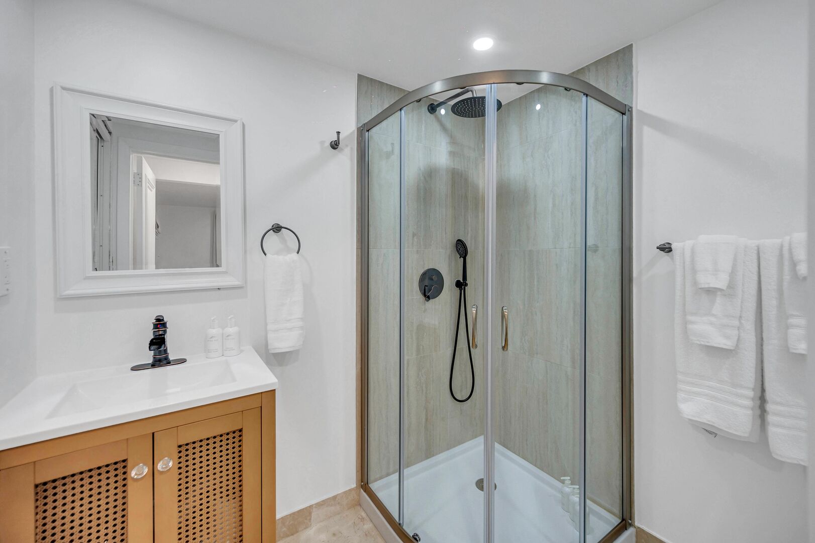 The ensuite bathroom of bedroom two features a shower.