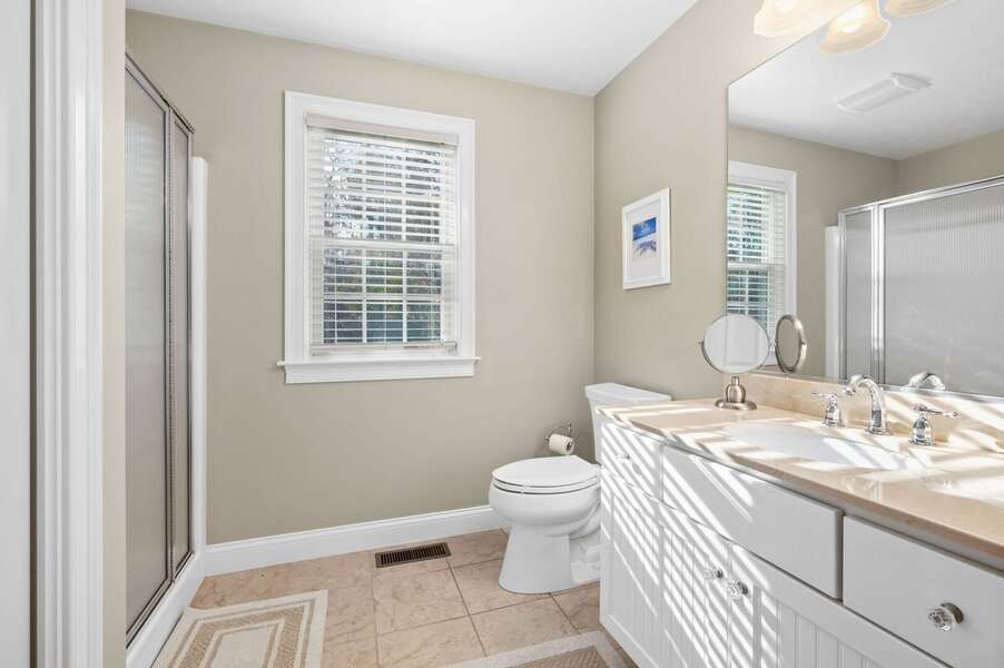 First floor full bathroom #1 offers an expansive double sink vanity space and shower - 195 Long Pond Drive Harwich - Cape Cod - Cape Time - NEVR