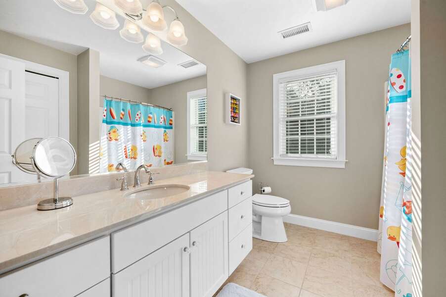 Bathroom #2 on the upper level of this home with plenty of countertop space for toiletries and a shower/tub combination - 195 Long Pond Drive Harwich - Cape Cod - Cape Time - NEVR