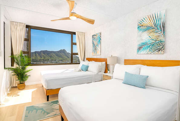 Have a restful sleep in your bedroom with queen-size and full-size beds and a stunning mountain view.