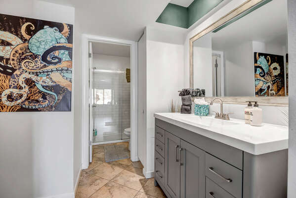 Master Bathroom with a Single Sink Vanity and a Large Glass Shower