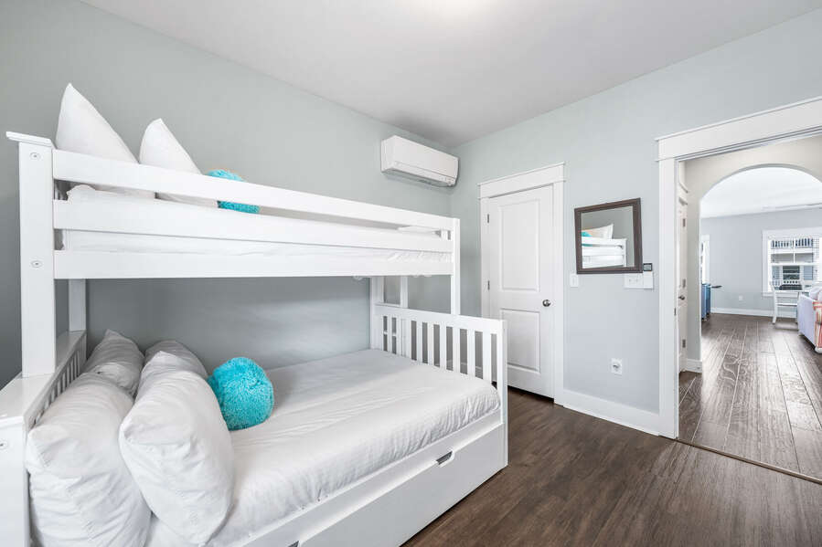 Guest bunk room with twin over full bunk bed and a twin trundle pull out bed underneath. This room has a spacious walk in closet with plenty of room for a portable crib or playpen.