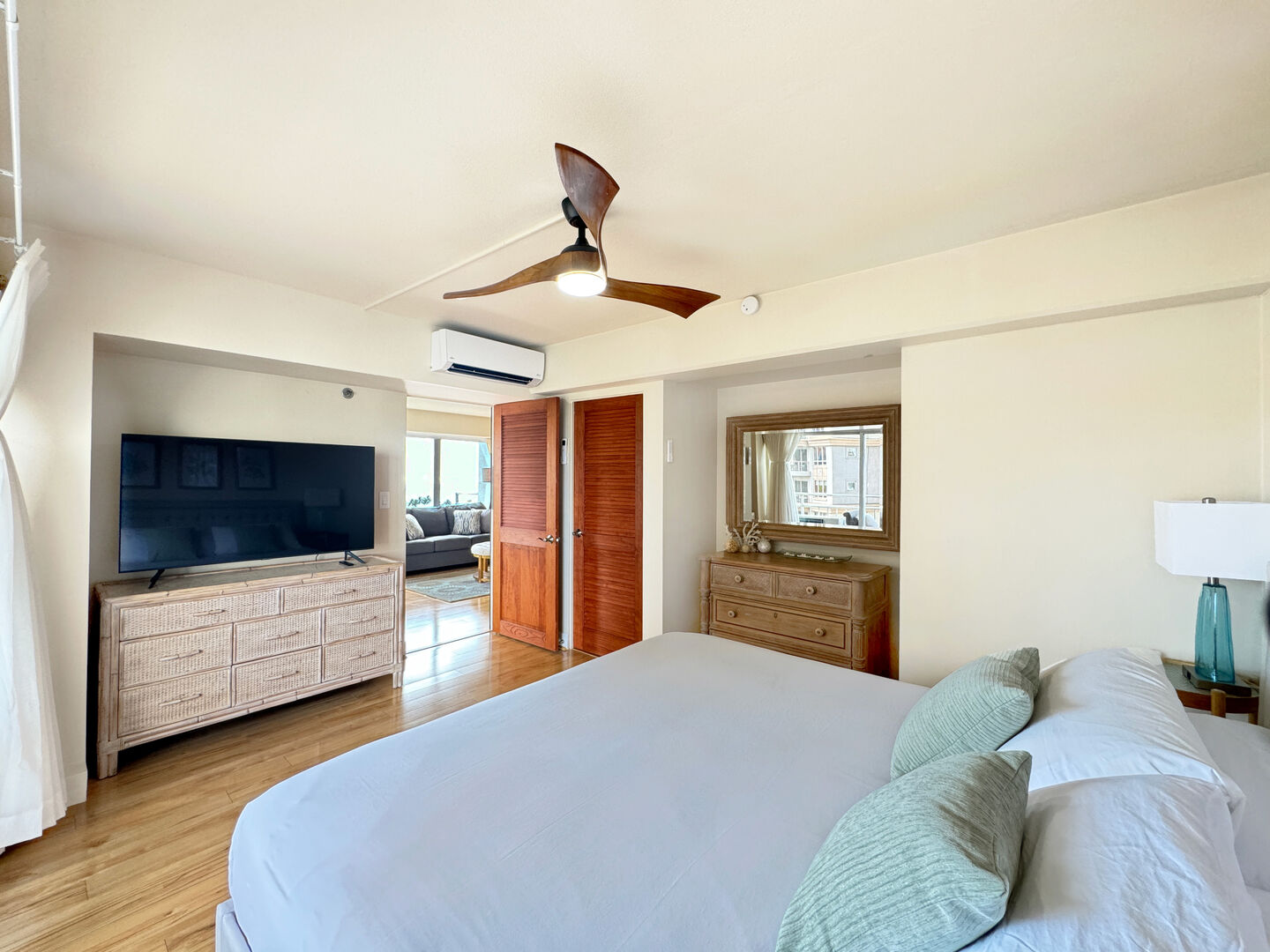 Master bedroom with ceiling fan and wall mounted AC