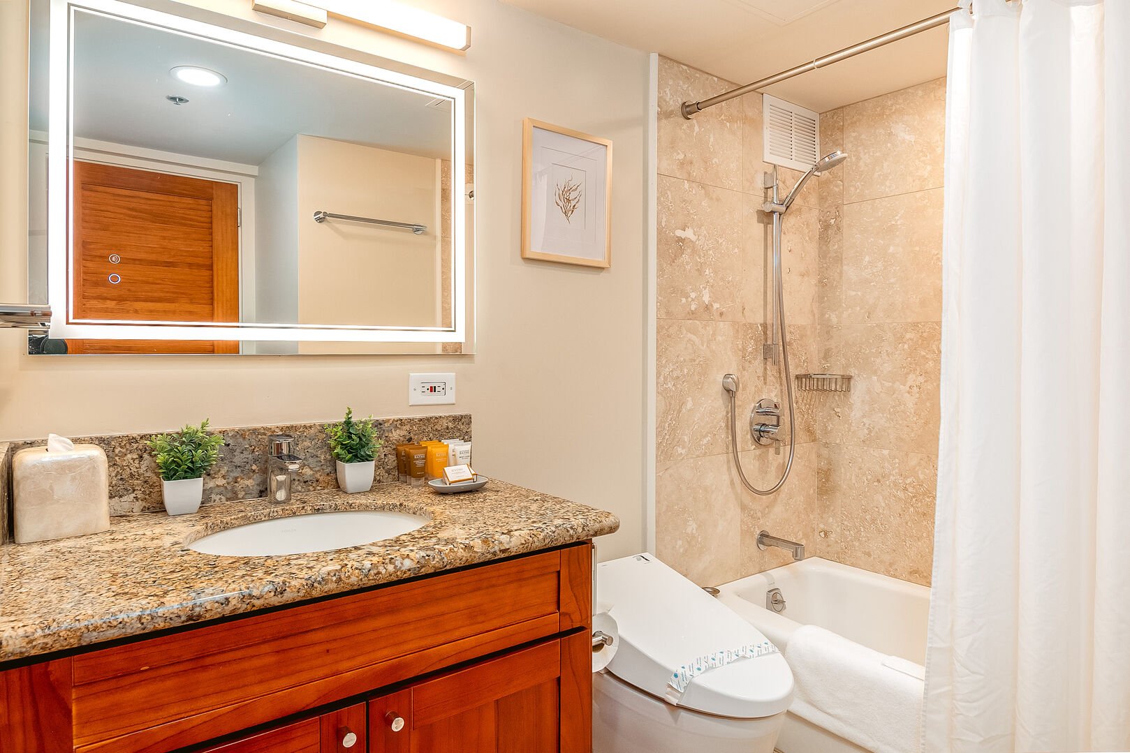 The master bedroom has a bathroom with tub and shower combo, and a vanity with cabinet.
