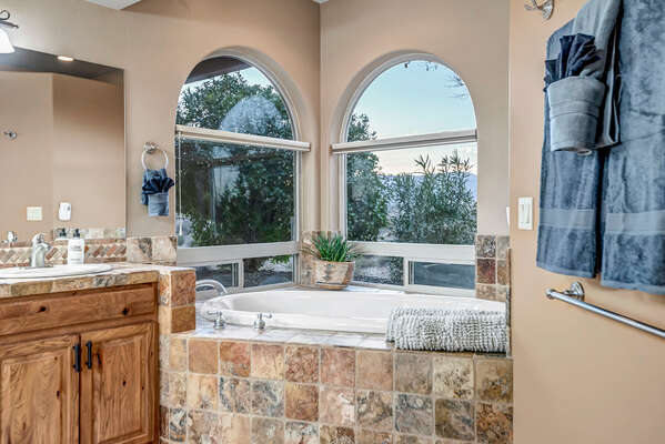 Master Bathroom with Dual Vanity, A Large Walk-in Shower, and A Separate Soaking Tub