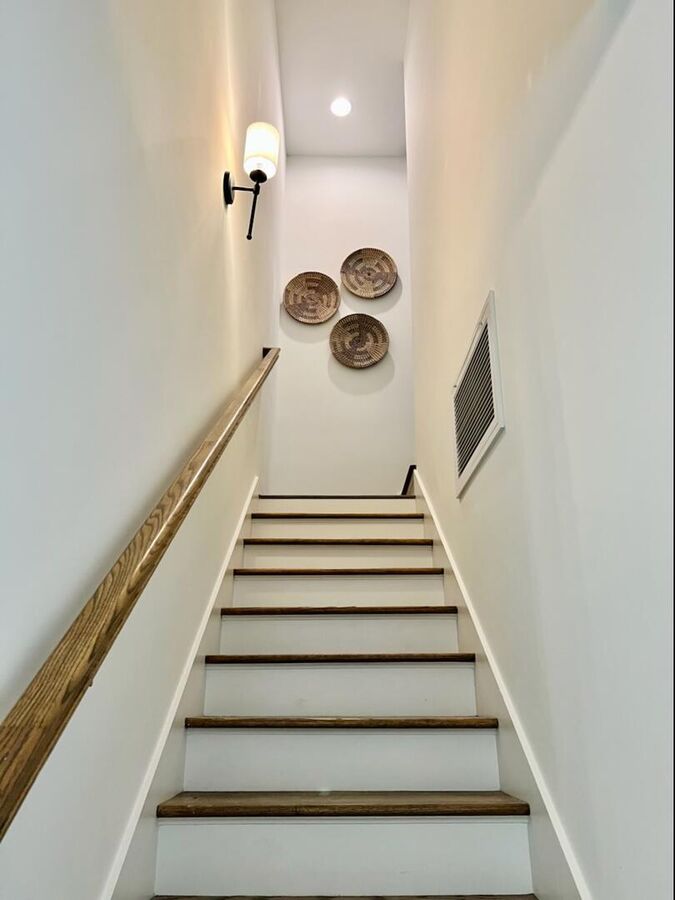An inviting staircase guiding you to the second floor.