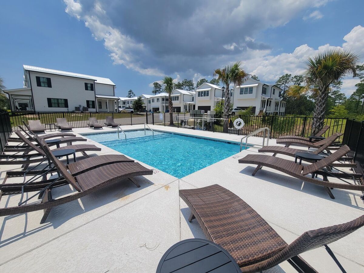 Take a refreshing swim in the communal pool within the Sunset Villas community.