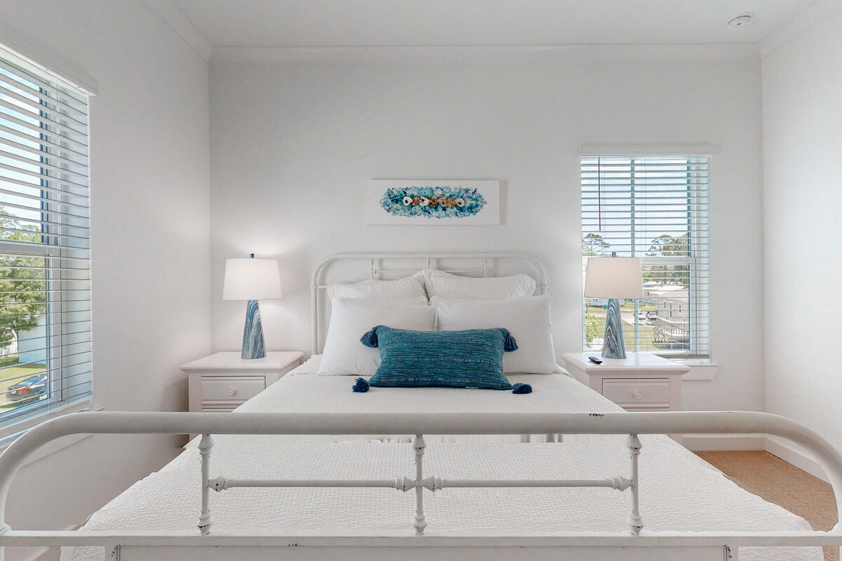 1st Guest Bedroom with comfortable queen size bed and coastal decor