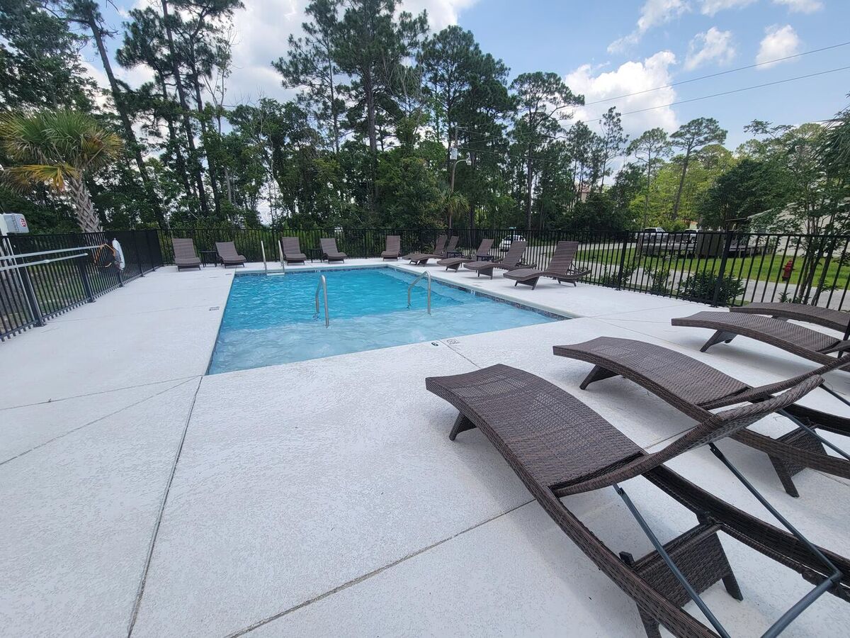 Bask in the sun by the outdoor community pool