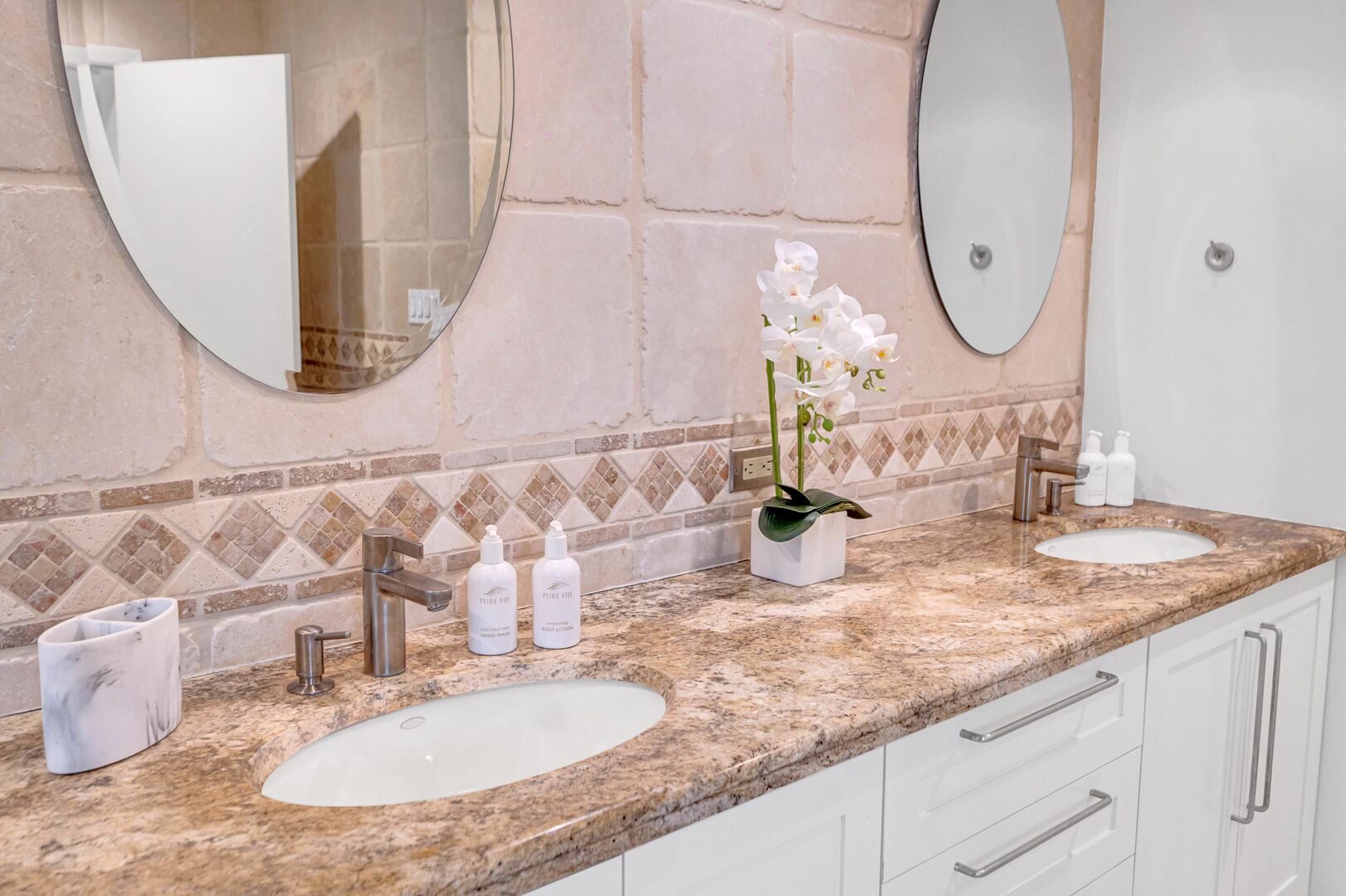The master bathroom features a double vanity.