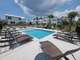 Community Outdoor Pool with Sundeck and Loungers